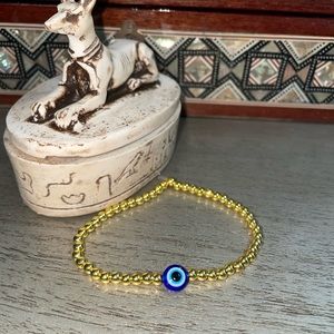 Evil Eye Beaded bracelet 7inch with some stretch. Stackable gold bead bracelet